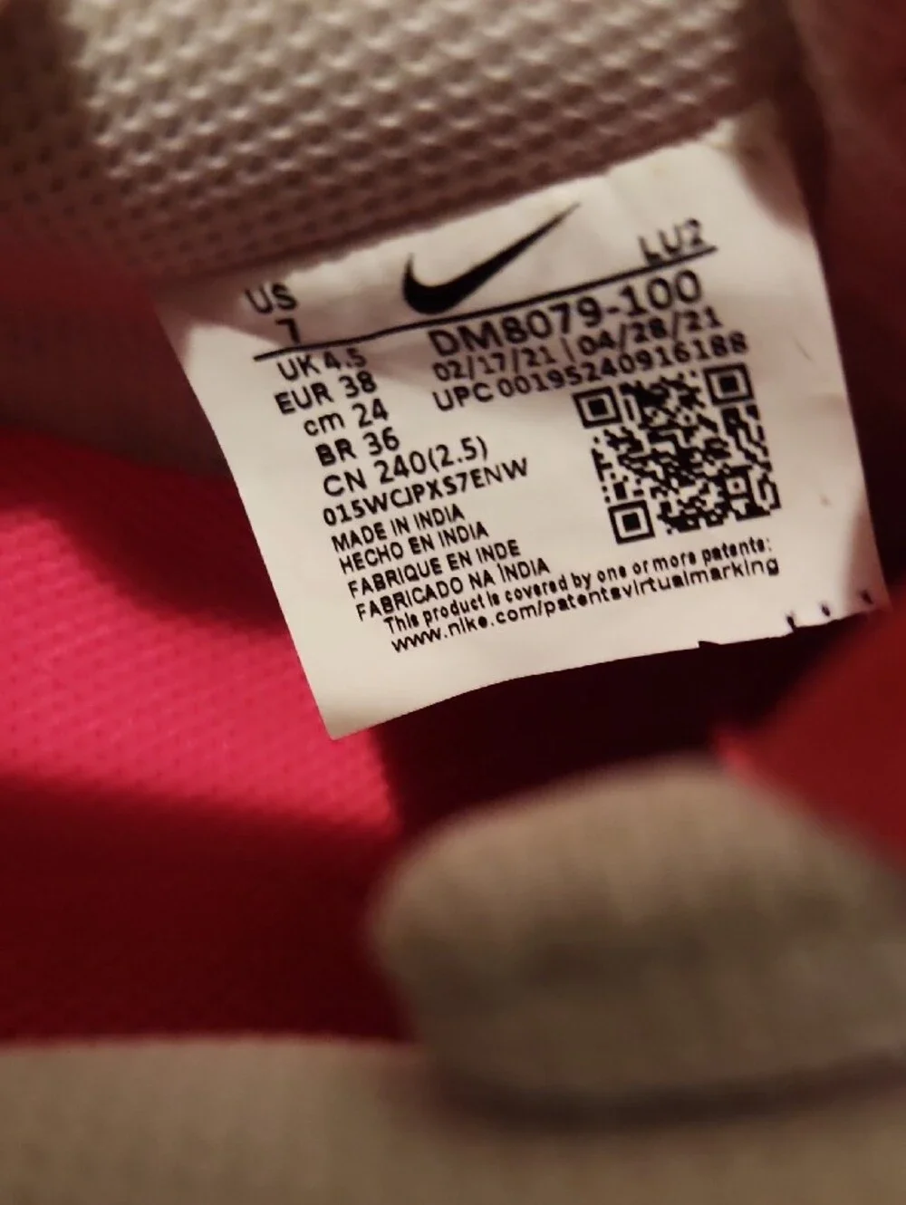 Nike Womens White Low-Top Sneakers with Black Swoosh and Pink Lining